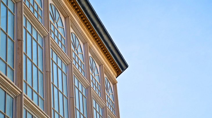 IMAGE: Conservatory windows reflect a bright blue sky
